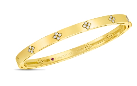 A yellow gold and platinum Roberto Coin bangle bracelet, available at Heller Jewelers.