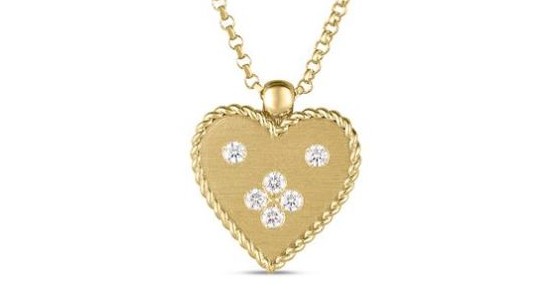 A Roberto Coin heart pendant necklace studded with round cut diamonds, available at Heller Jewelers.