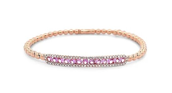 A rose gold bracelet from Hulchi Belluni featuring pink sapphires and diamond accents, available at Heller Jewelers.