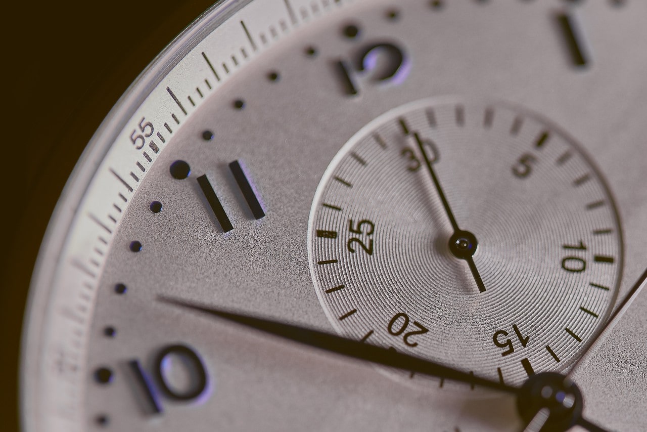 A close-up of a watch with a tachymeter complication on the dial’s center.