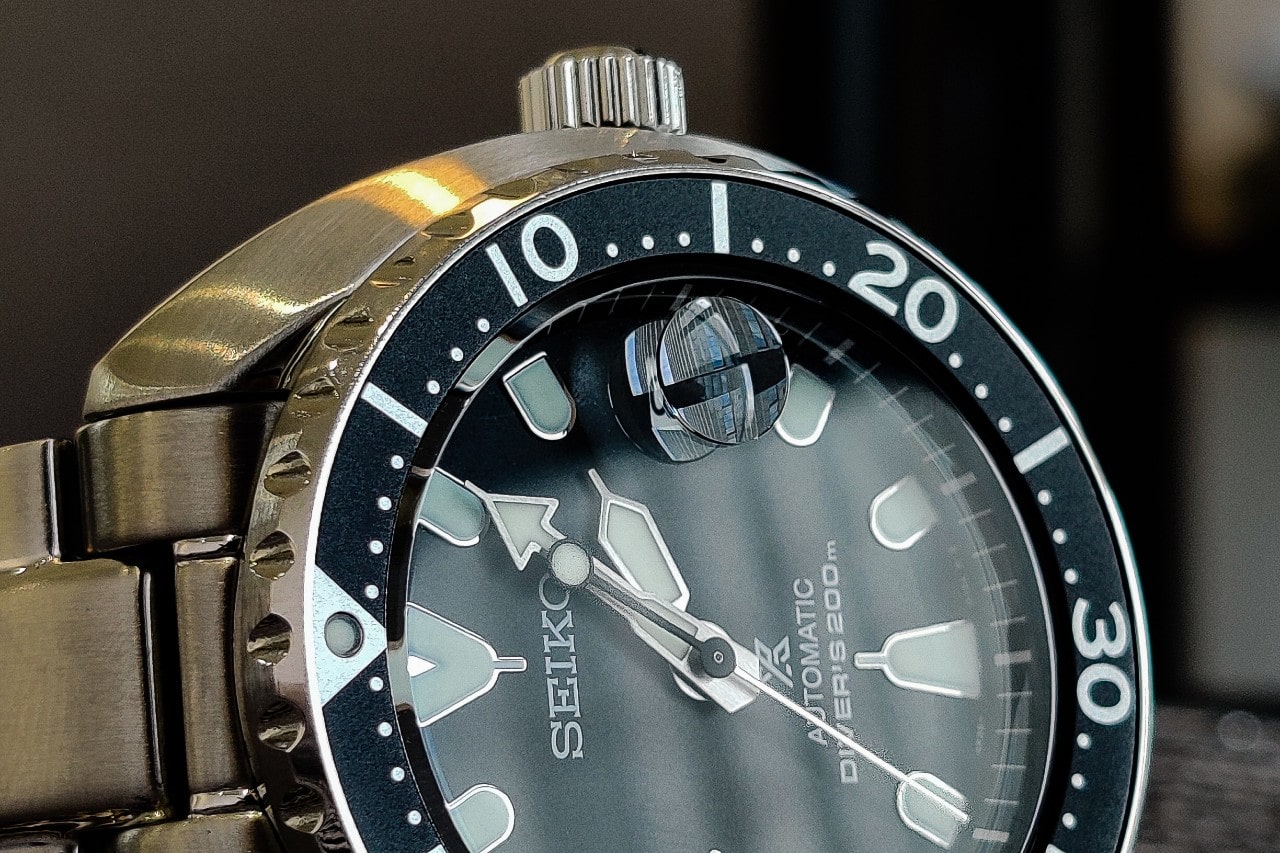 A close-up of a Seiko watch with a rotating bezel.