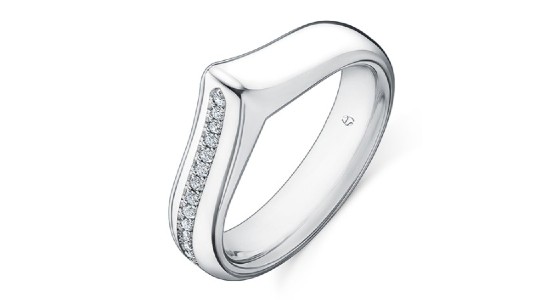 a white gold, thick banded fashion ring with diamond accents