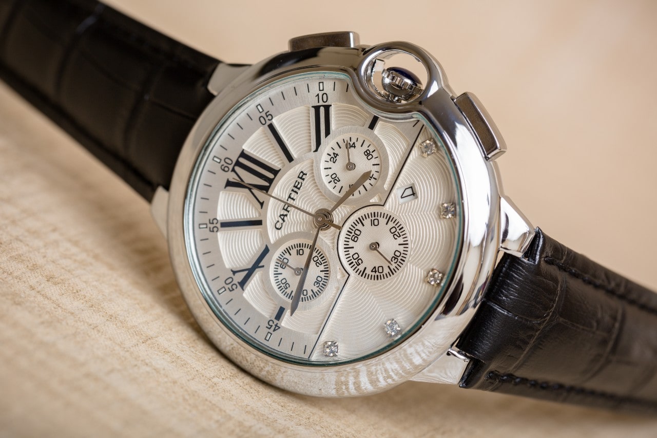 A close-up image of a Cartier watch with multiple complications.